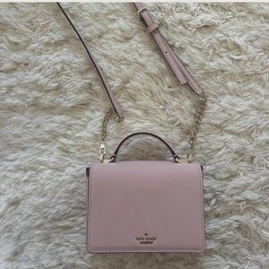 Kate Spade Pink Crossbody Bag with Adjustable Strap and Flap Closure